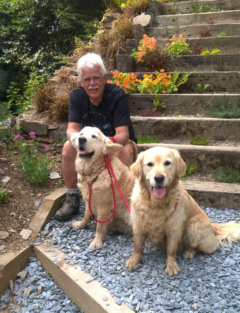 Me with our present 2 Golden Retrievers Mica and Ember